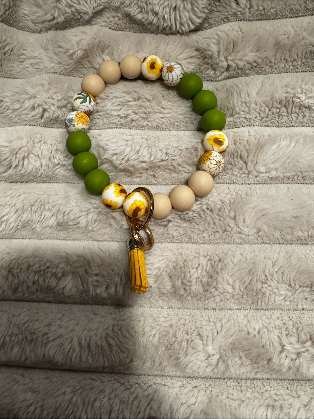 Green and Beige Floral Beaded Bracelet with Yellow Tassel